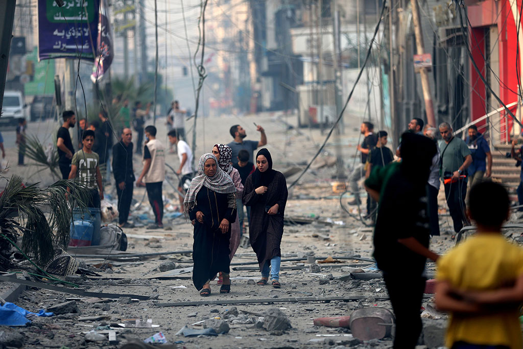 Two women walking in Gaza, October 8th, 2023. Photographer: Mohammed Zaanoun/Activestills